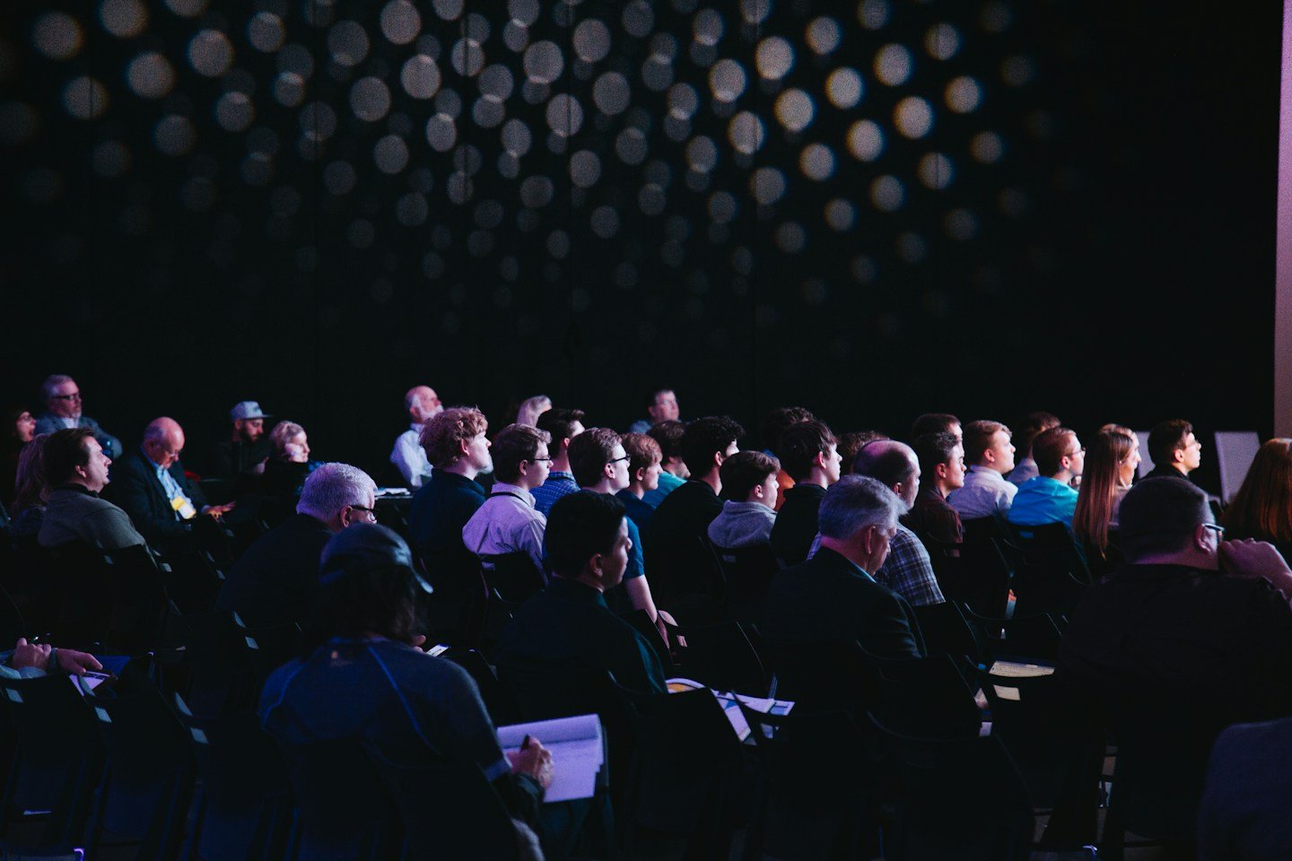 An audience gathered for a corporate presentation